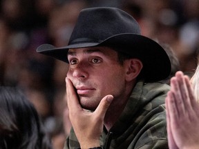 Montreal Canadiens' Carey Price watches a preseason NBA game in Montreal on Friday, Oct. 14, 2022.