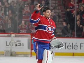 Montreal Canadiens' Carey Price waves to the crowd after being named first star following a shutout of the St. Louis Blues in Montreal on Oct. 20, 2015.