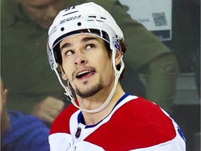 Canadiens forward Sean Monahan watches a video tribute honouring him on the scoreboard at Calgary’s Scotiabank Saddledome during first period of Thursday night’s game.