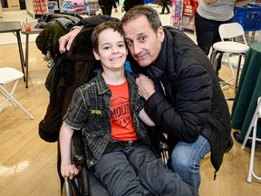 Ross Paperman with Charles at a Christmas gift giveaway at Toys"R"Us a few years ago.