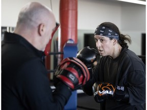 Mary Spencer trains with Ian MacKillop as she prepares for a world-title bout in Shawinigan against Femke Hermans. She is seen at Ramsay Boxing Academy in Montreal, on Dec. 12, 2022.
