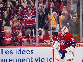 Canadiens fans celebrate after goalie Jake Allen stopped Flames' Nazem Kadri to win Monday's game in a shootout.