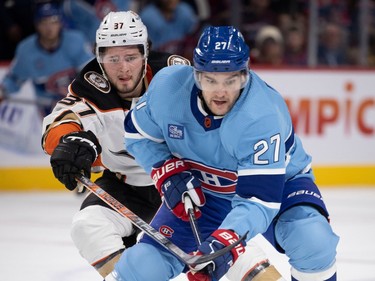 Anaheim Ducks centre Mason McTavish (37) chases Montreal Canadiens left wing Jonathan Drouin (27) during NHL action in Montreal, on Thursday, Dec. 15, 2022.