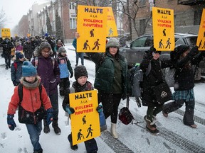 Youngsters walk from Parc des Royaux to their school on Friday, December 16, 2022 to honour seven-year-old Maria Legenkovska, who was killed nearby by a hit-and-run driver.