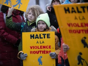 Youngsters gather at Parc des Royaux in Montreal on Friday, Dec. 16, 2022  to commemorate seven-year-old Mariia Legenkovska, who died after being hit by a car nearby on Dec. 13.