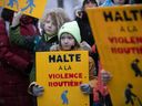Youngsters gather at Parc des Royaux in Montreal on Friday, Dec. 16, 2022  to commemorate seven-year-old Maria Legenkovska, who died after being hit by a car nearby on Tuesday morning.