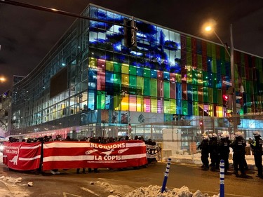 Protesters march outside the Palais des Congrès on the last day of COP15 in Montreal on Monday, Dec. 19, 2022.