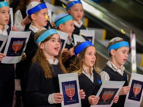 The Calgary Jewish school choir performs at the community Menorah lighting on Dec. 19.