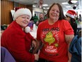 Linda DeGagné (right) shows off her T-shirt while talking to Johanne Ranger at a Christmas party at Sarto Desnoyers Community Centre in Dorval last Friday, held for adults using community and institutional mental health services.