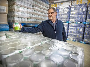Martin Munger, general manager of Banques alimentaire du Québec, checks out a pallet of canned peas at Moisson Montréal on Dec. 13, 2022.