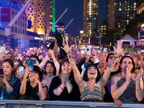MONTREAL, QUE.: July 9, 2022 -- Crowds cheer as Roots performs the closing act of the Montreal Jazz Festival, in Montreal on Saturday, July 9, 2022.