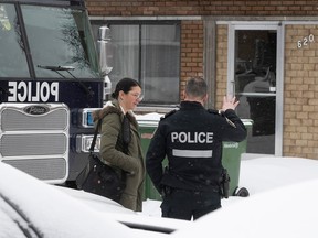 Police investigate after a man and woman were found dead at a home in Montreal Dec. 27, 2022.