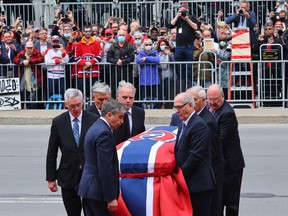 Pallbearers carry Guy Lafleur's casket into Mary Queen of the World Cathedral in Montreal for his funeral on May 3, 2022.