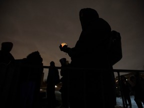 People attend a vigil for Nicous D'Andre Spring at Benny Park in Notre-Dame-de-Grâce on Friday, Dec. 30, 2022. D'Andre Spring, 21, died of his injuries following a "physical intervention" while he was detained at Montreal's Bordeaux jail on Dec. 24.