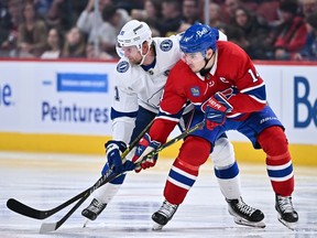 Tampa Bay Lightning's Steven Stamkos (91) and Canadiens' Nick Suzuki (14) skate against each other during the third period at the Bell Centre on Saturday, Dec. 17, 2022, in Montreal.