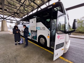 An Orléans Express bus is pictured taking passengers from the Ottawa train station.