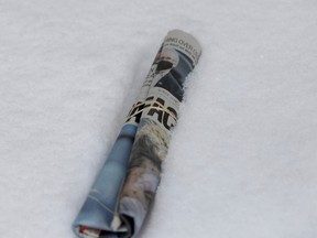 A copy of the Montreal Gazette delivered during a snow fall.