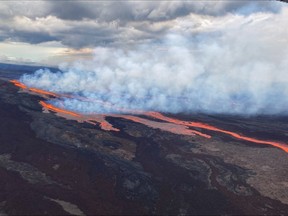 This aerial image released by the U.S. Geological Survey (USGS) from Civil Air Patrol on November 28, 2022, shows the lava on the northeast rift zone of Mauna Loa in Hawaii, the largest active volcano in the world.