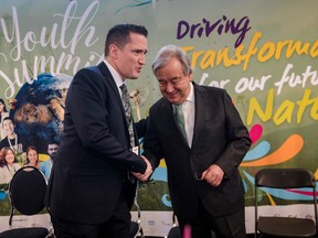 United Nations Secretary-General António Guterres, right, and Benoit Charette, Quebec minister of sustainable development and environment, shake hands during the United Nations Biodiversity Conference (COP15) Youth Summit at Quai Alexandra in the Old Port of Montreal on December 6, 2022.