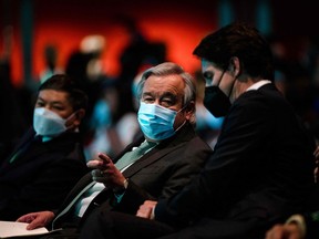 United Nations Secretary-General Antonio Guterres speaks with Prime Minister Justin Trudeau during the opening ceremony of the United Nations Biodiversity Conference (COP15) at the Palais des congrès in Montreal on Wednesday, Dec. 6, 2022.