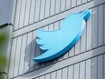 The Twitter logo is displayed outside the headquarters in San Francisco, Calif.