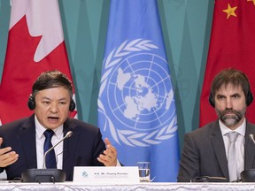 Huang Runqiu, Minister of Ecology and Environment of China and president of the COP15, responds to a question as Canadian Environment Minister Steven Guilbeault looks on during the closing news conference at the COP15 UN conference on biodiversity in Montreal, on Tuesday, December 20, 2022.