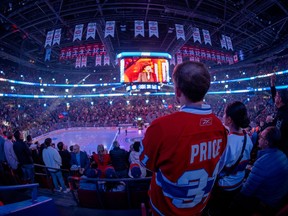 Fans cheer as Carey Price is introduced during a pre-game ceremony prior to facing the Toronto Maple Leafs in their regular season NHL home opener in Montreal, on Wednesday, Oct. 12, 2022.