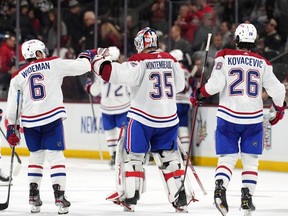 Canadiens defencemen Chris Wideman and Johnathan Kovacevic congratulate goalie Samuel Montembeault after Monday night’s 3-2 overtime win over the Arizona Coyotes at Mullett Arena in Tempe, Ariz.