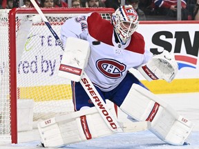 Canadiens goalie Jake Allen makes one of his 45 saves during 2-1 win over the Flames Thursday night at Calgary’s Scotiabank Saddledome.