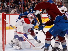 Canadiens goalie Jake Allen makes save during second period of Wednesday night’s game against the Colorado Avalanche at Ball Arena in Denver.