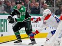 Stars defenceman Ryan Suter clears the puck in front of Canadiens forward Joel Armia during first period of Friday night’s game at the American Airlines Center in Dallas.