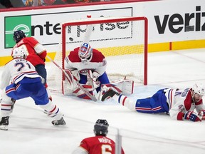 Florida Panthers centre Carter Verhaeghe (23) scores a goal on the Montreal Canadiens' Sam Montembeault (35) during the third period at FLA Live Arena on Thursday December 29, 2022.
