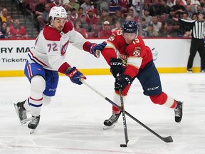 Florida Panthers centre Anton Lundell (15) and Montreal Canadiens defenceman Arber Xhekaj (72) battle for the puck during the second period at FLA Live Arena on Thursday December 29, 2022.