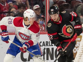 Canadiens centre Christian Dvorak (28) battles with Ottawa Senators defenceman Nikita Zaitsev (22) in the second period at the Canadian Tire Centre in Ottawa on Wednesday, Dec. 14, 2022.