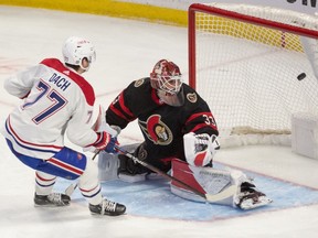 Canadiens' Kirby Dach (77) scores against Senators goalie Cam Talbot (33) at the Canadian Tire Centre on Dec. 14, 2022, in Ottawa.