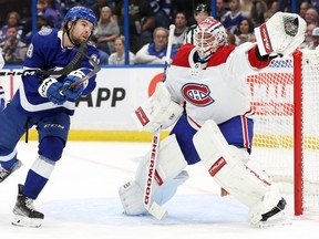 Canadiens goaltender Jake Allen (34) makes a save against the Tampa Bay Lightning during the first period at Amalie Arena in Tampa, Fla., on Dec. 28, 2022.