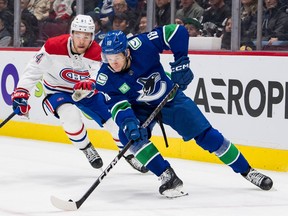 Dec 5, 2022; Vancouver, British Columbia, CAN; Montreal Canadiens defenseman Jordan Harris (54) skates after Vancouver Canucks forward Jack Studnicka (18) in the first period at Rogers Arena. Mandatory Credit: Bob Frid-USA TODAY Sports