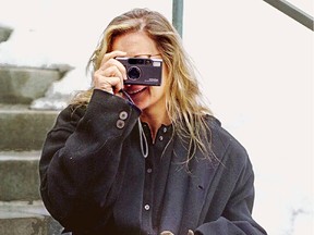 Annie Leibovitz snaps a picture as she is being photographed for the Montreal Gazette Monday, March 7, 1994.
