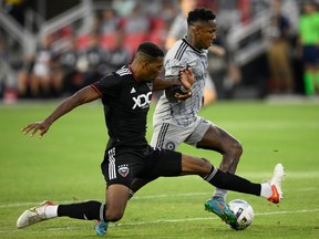 CF Montréal forward Romell Quioto, right, battles D.C. United defender Donovan Pines during first half on July 23, 2022, in Washington.