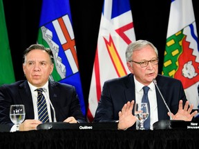 Blaine Higgs, right, premier of New Brunswick, speaks as François Legault, Premier of Quebec listens during a meeting of the Council of the Federation in 2019. A "lack of respect for both official language minorities could prove extremely damaging to national unity," Tom Mulcair writes.