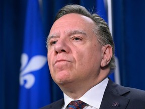 Quebec Premier Francois Legault ponders a questions at a news conference on Dec. 14, 2022