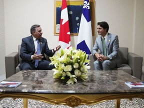 Prime Minister Justin Trudeau, right, takes part in a bilateral meeting with Premier François Legault during the Francophonie Summit in Djerba, Tunisia, Saturday, Nov. 19, 2022. A highly anticipated meeting between Trudeau and Legault in Montreal was postponed Friday because of inclement weather.