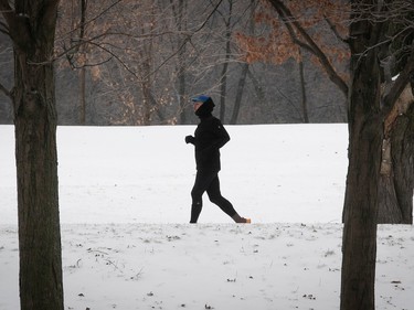 A jogger makes his way along Olmsted Road on Mount Royal on Thursday Jan. 5, 2023.