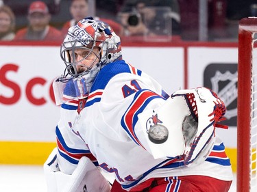 Canadiens right wing Joel Armia (40) looks on as New York Rangers goaltender Jaroslav Halak (41) reaches for a wide shot on net during NHL action in Montreal, on Thursday, Jan. 5, 2023.