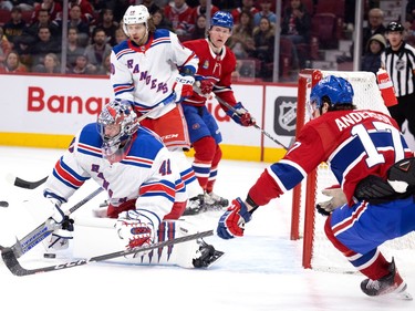 New York Rangers goaltender Jaroslav Halak (41) dives win a rebound as Montreal Canadiens right wing Josh Anderson (17) closes in during NHL action in Montreal, on Thursday, Jan. 5, 2023.