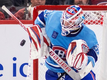 Canadiens' Sam Montembeault makes a blocker save during third period of a National Hockey League game against the Seattle Kraken in Montreal Monday Jan. 9, 2023.