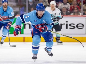 Montreal Canadiens centre Nick Suzuki skates through centre ice during third period against the Seattle Kraken in Montreal on Jan. 9, 2023.