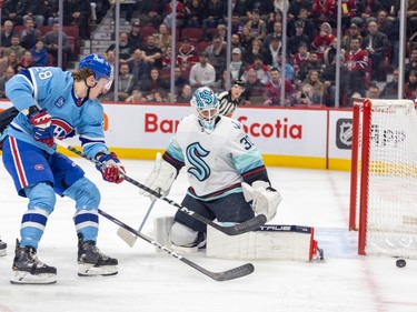 Canadiens' Christian Dvorak has his shot steered aside by Seattle Kraken goalie Martin Jones during the first period of a National Hockey League game in Montreal Monday Jan. 9, 2023.