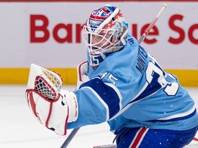 Canadiens' Sam Montembeault makes a glove save during the second period of a National Hockey League game against the Seattle Kraken in Montreal Monday Jan. 9, 2023.