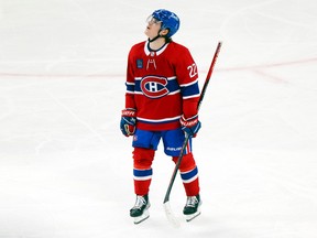 Montreal Canadiens' Cole Caufield watches replay of his second goal of the game against the Nashville Predators during third period in Montreal on Jan. 12, 2023.